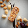 Almond Vanilla food bar surrounded by whole ingredients