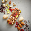 Goji Berry Trailmix bar unwrapped with whole ingredients